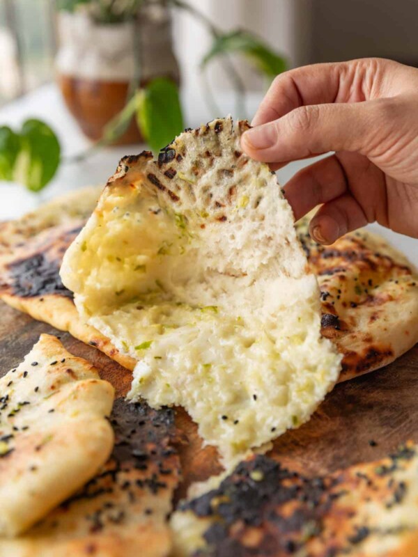 a picture of a cross-section of thecha naan with the stuffing visible