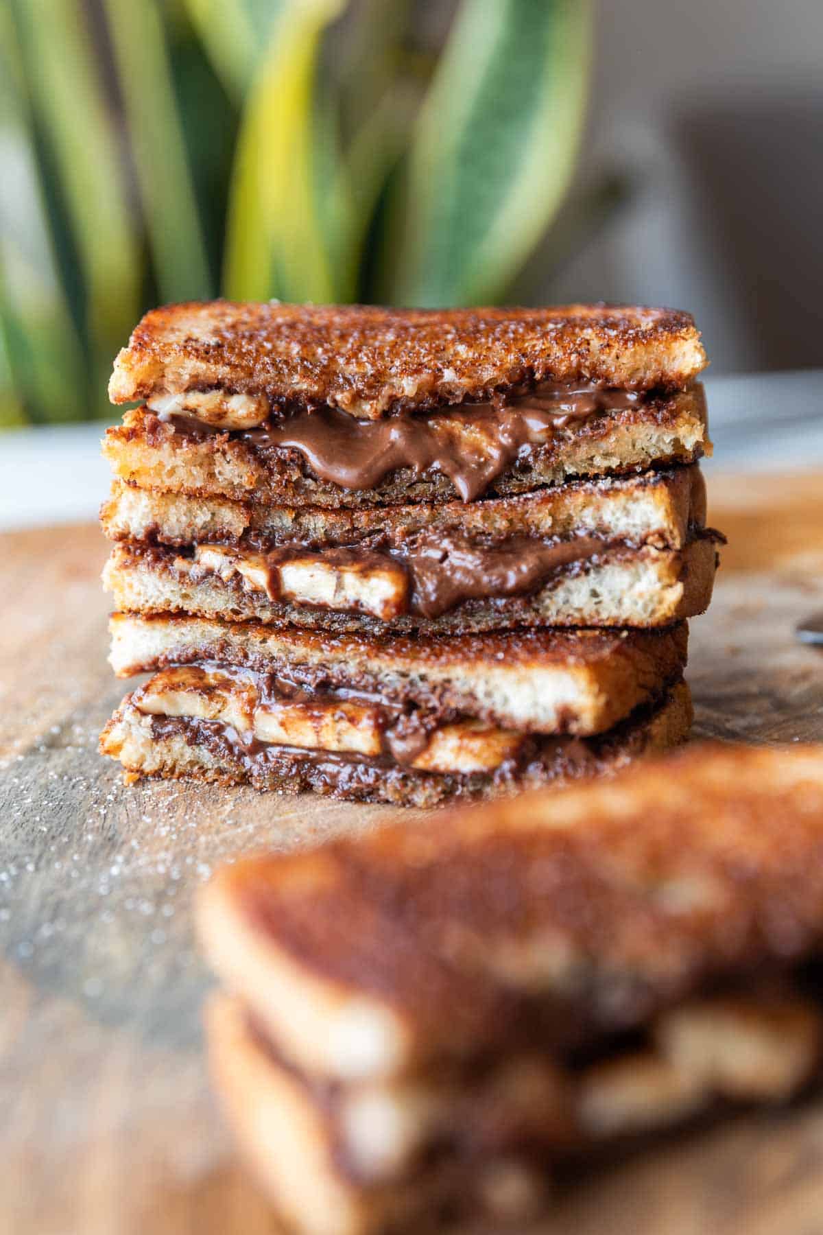 grilled chocolate banana sandwich on a wooden board