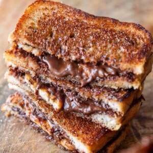 grilled chocolate banana sandwich on a wooden board