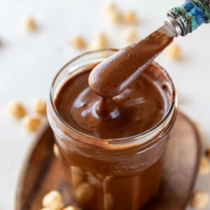 Homemade Nutella chocolate spread in a jar with spoon
