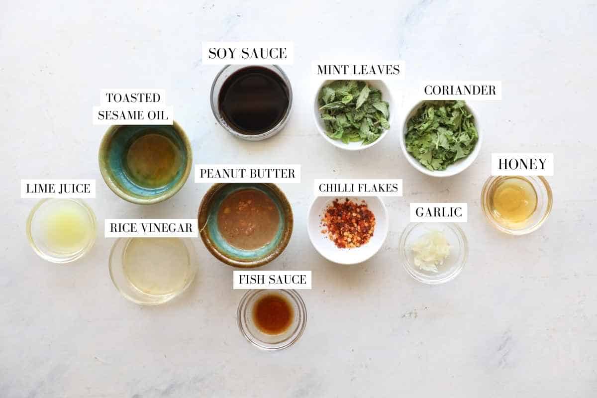 Asian Slaw sauce ingredients in bowls with text overlay