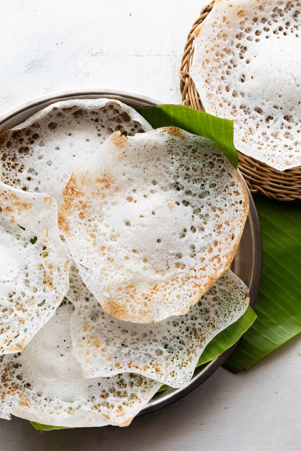 tender coconut appam placed on banana leaf ready to serve