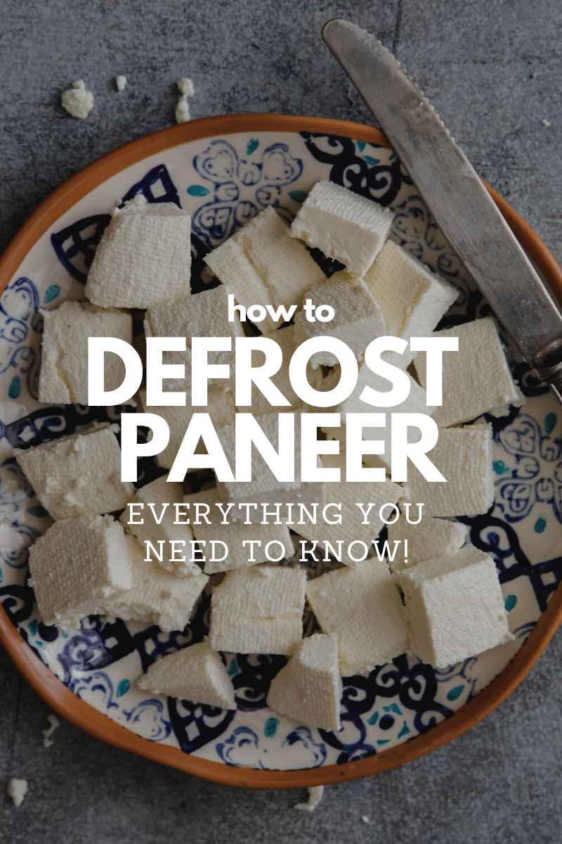 Fresh paneer cubes on a plate with a knife