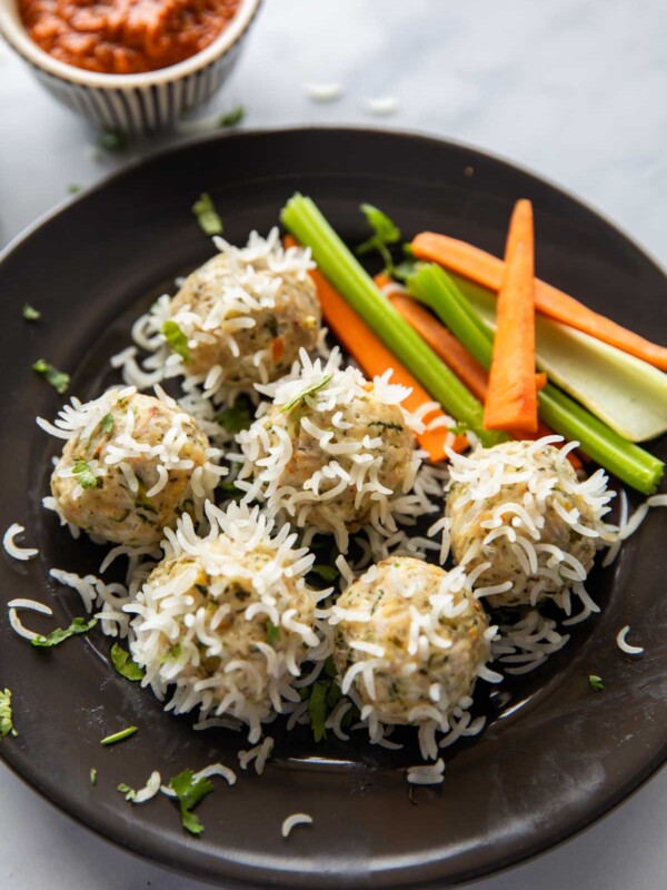 chicken porcupine meatballs served with a salad and a dipping sauce