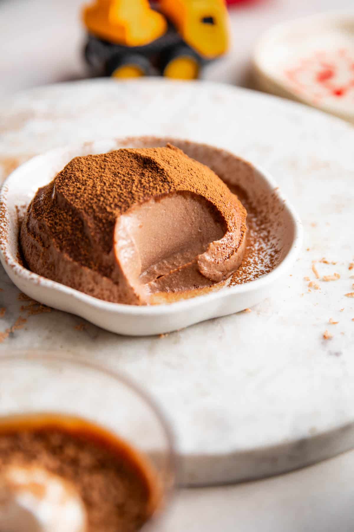 Smooth & creamy paneer chocolate pudding served on a white plate