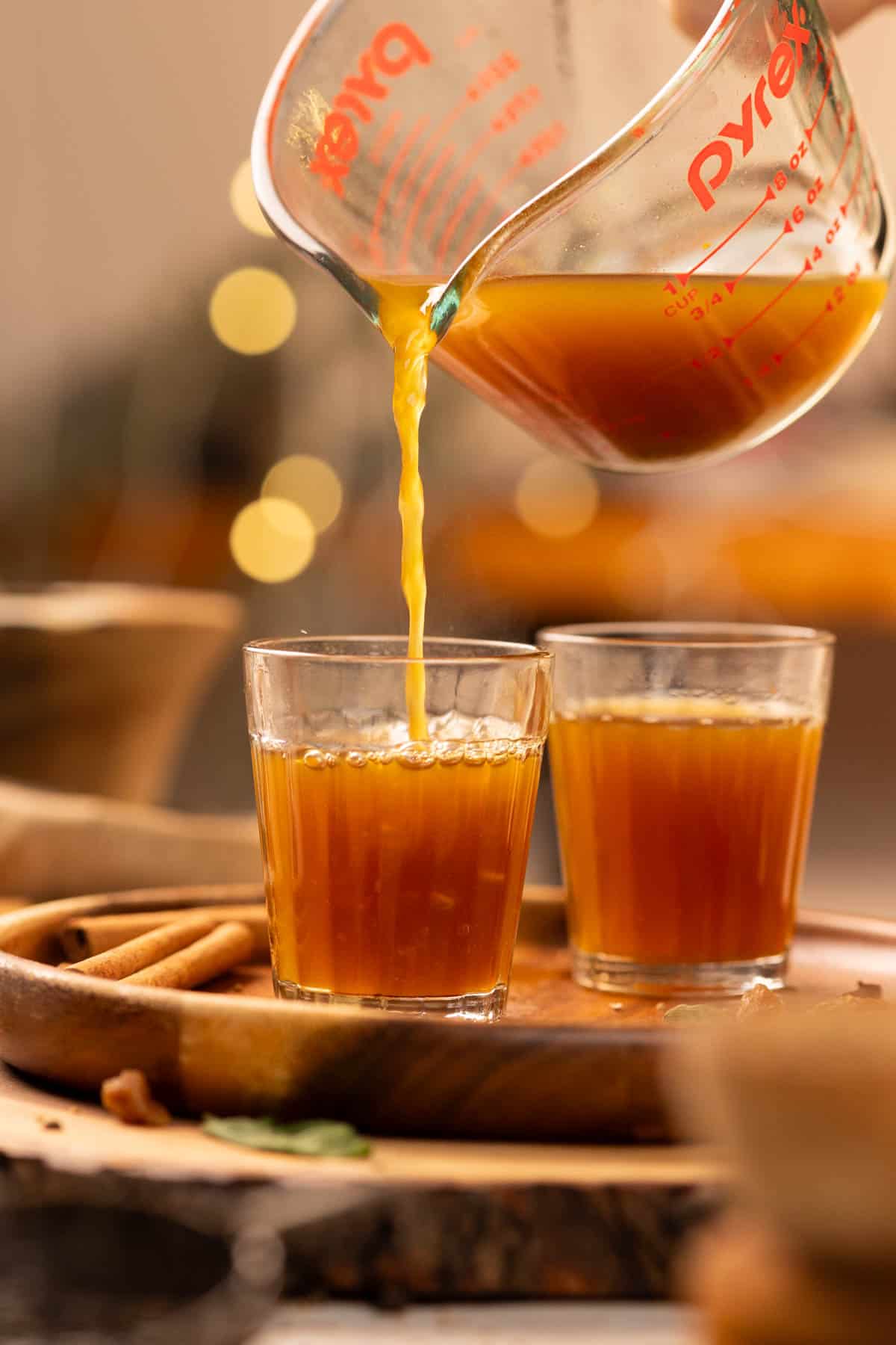 pouring pipping hot kadha into glasses