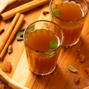 kadha garnished with fresh tulsi leaves