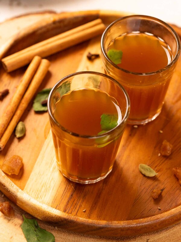 kadha garnished with fresh tulsi leaves