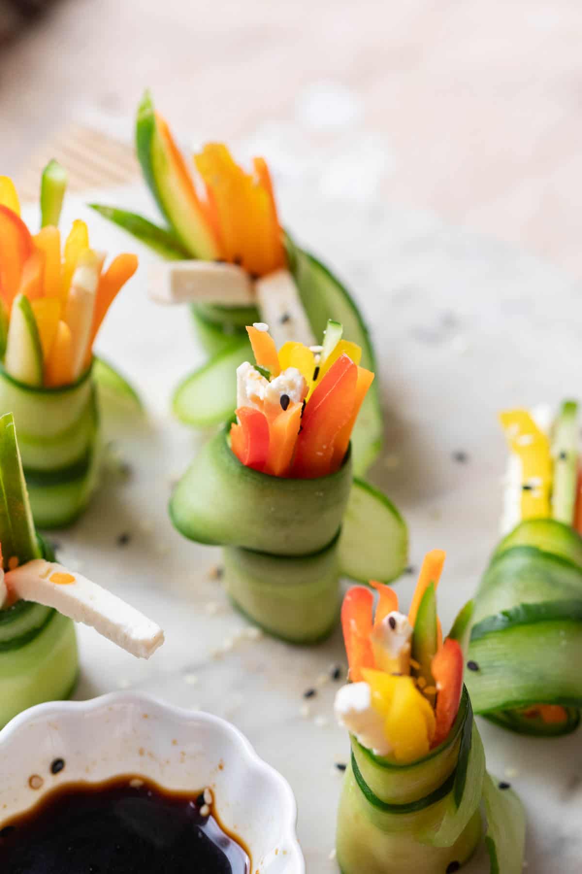 cucumber rolls served on a white platter