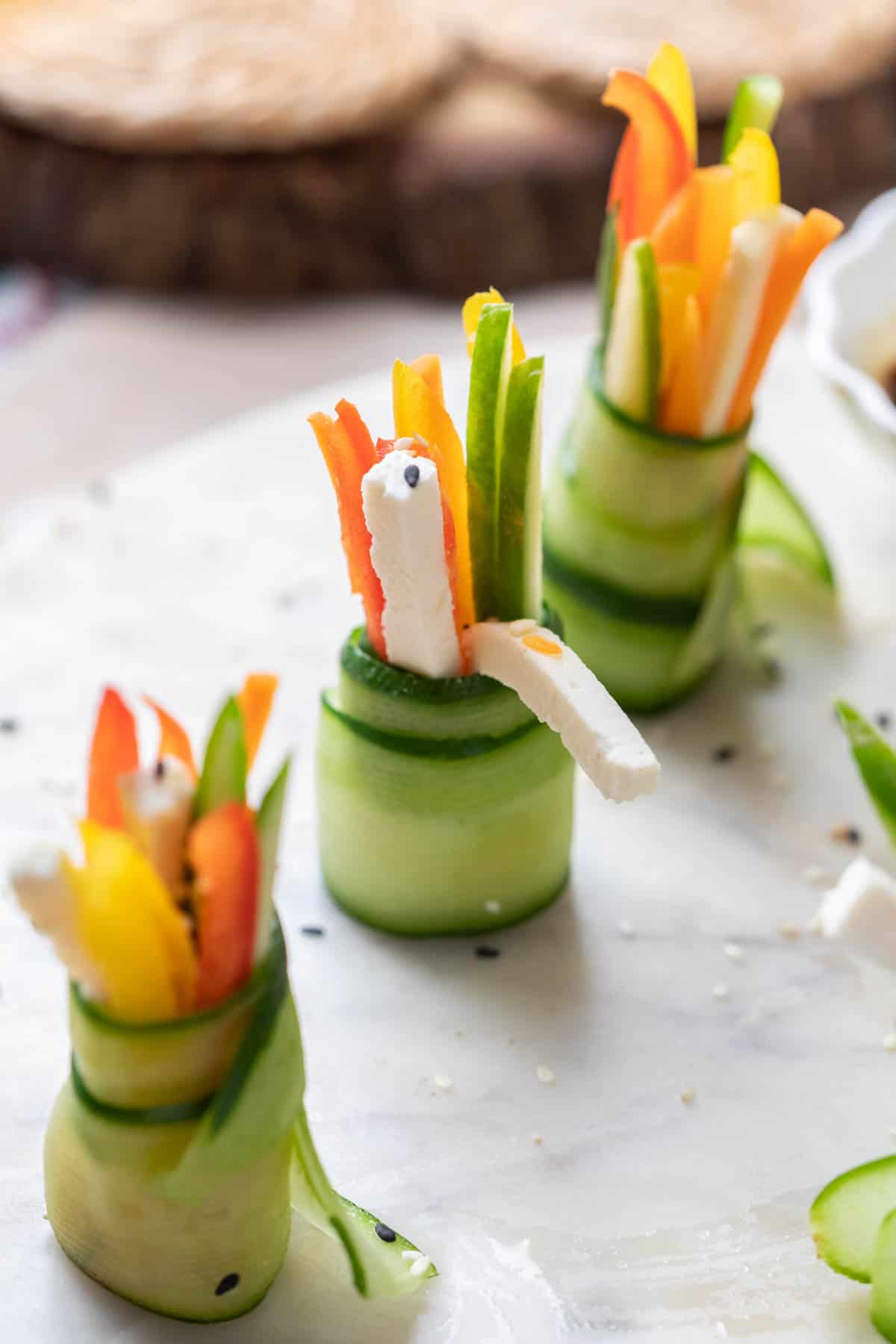 cucumber rolls served on a white platter