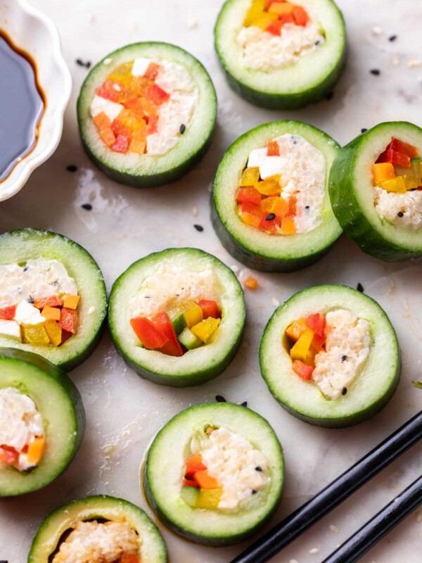 cucumber sushi served with chopsticks and soy sauce