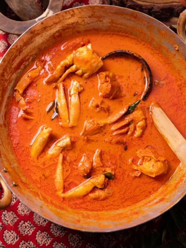 Mangalorean crab curry in a kadai with ladle