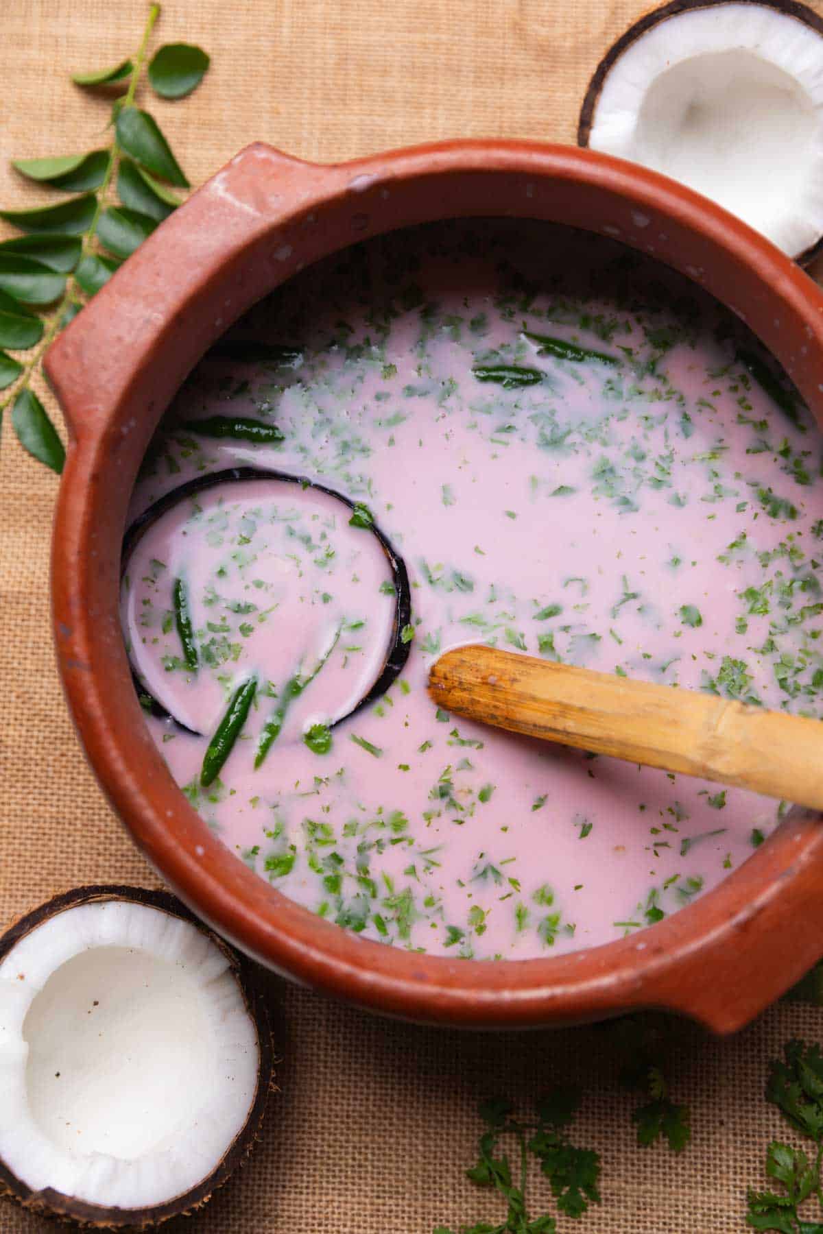 sol kadhi in a big earthen bowl with ladle  