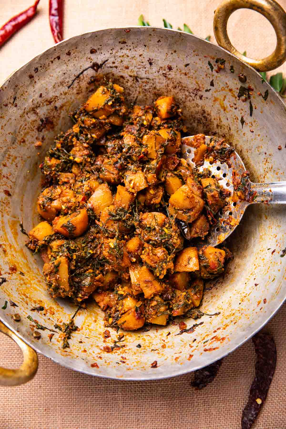 freshly made dhaba style aloo palak in a kadai