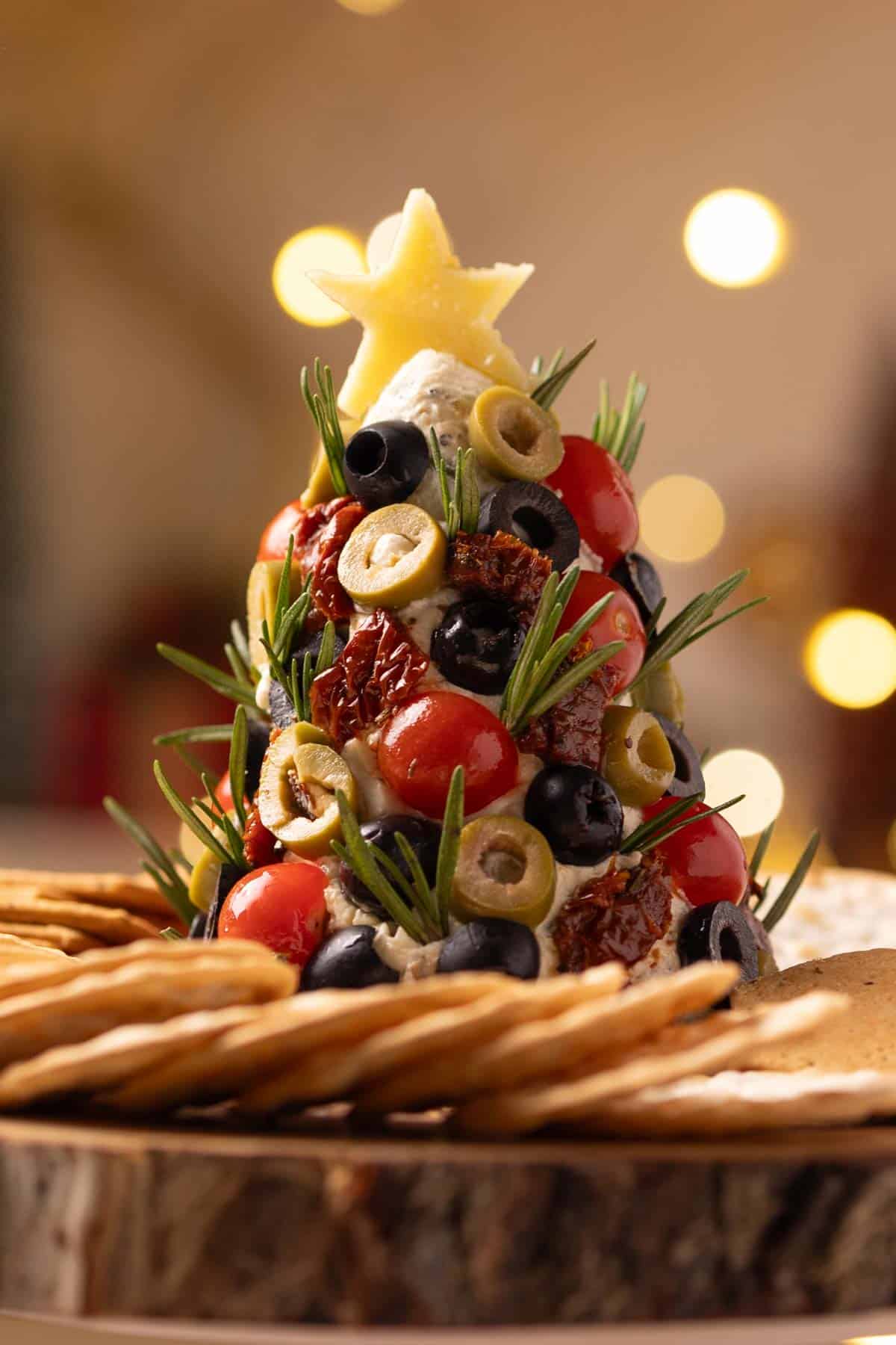 an image of cheese ball christmas tree with crackers 