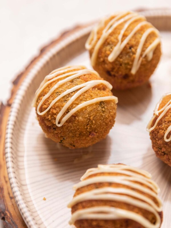 a close up image of chicken curry rice balls placed on a platter