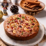 an image of freshly-baked whole eggless plum cake