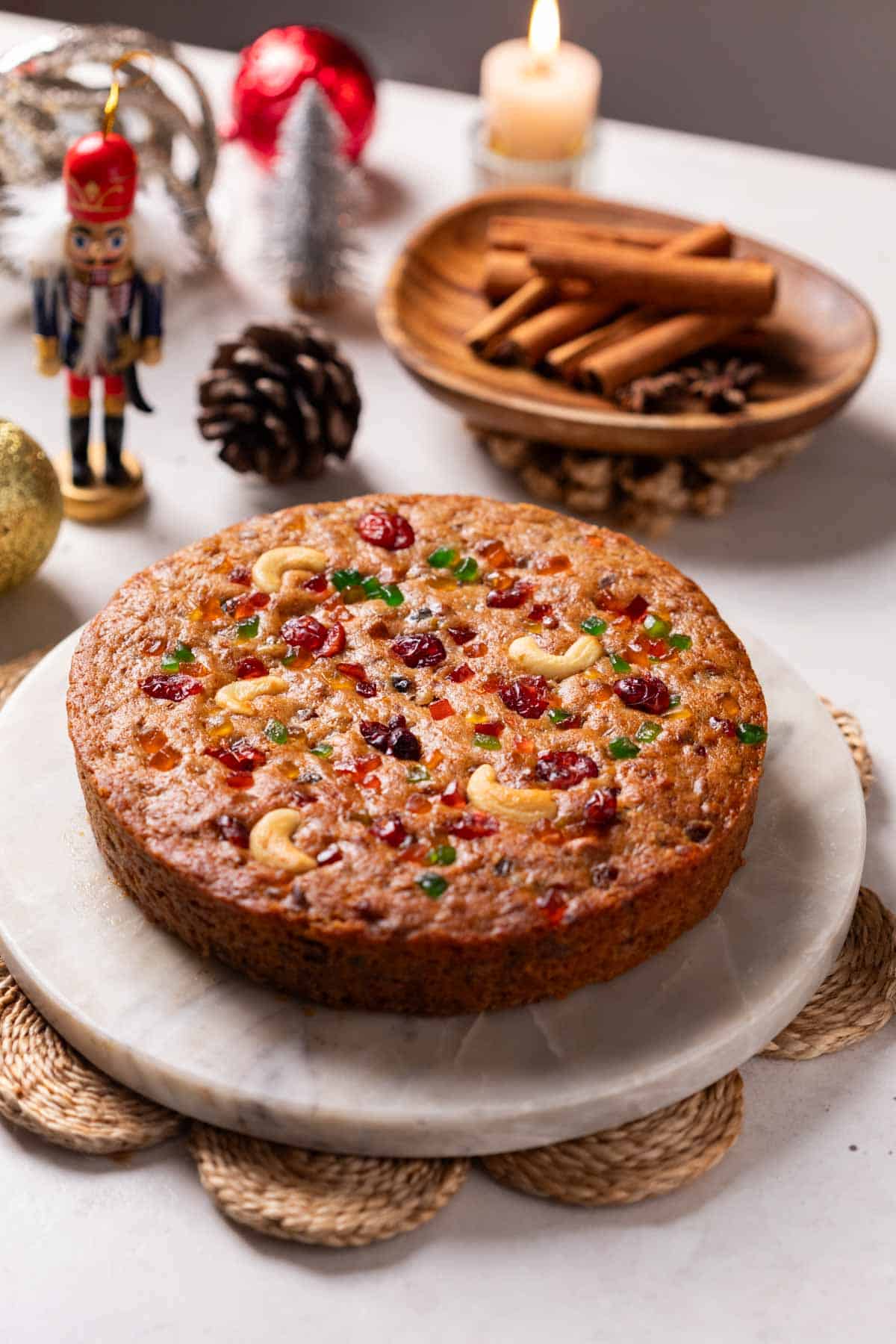 an image of freshly-baked whole eggless plum cake 