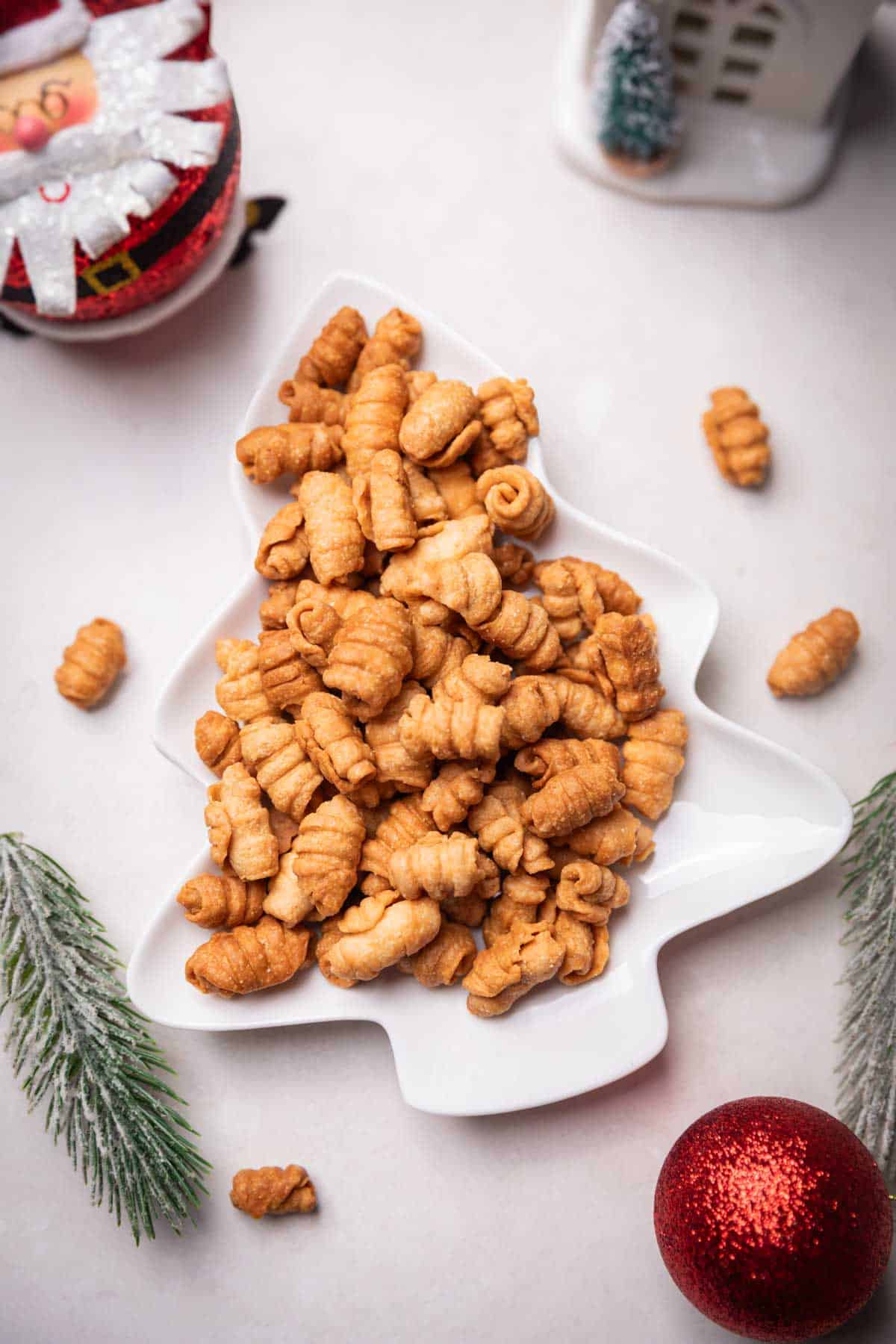 kulkuls on a white plate with chirstmas-y decor        