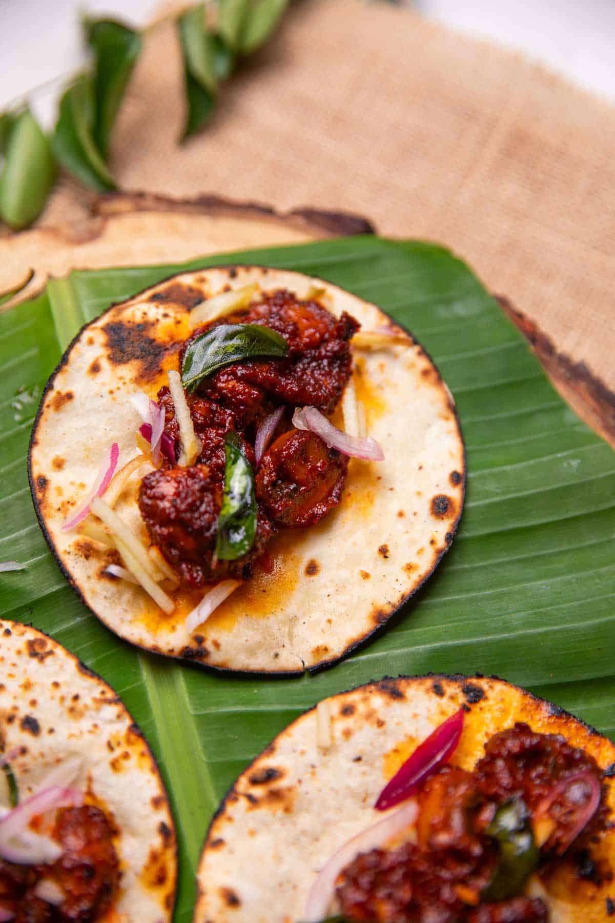 mushroom ghee roast tacos served on a leaf