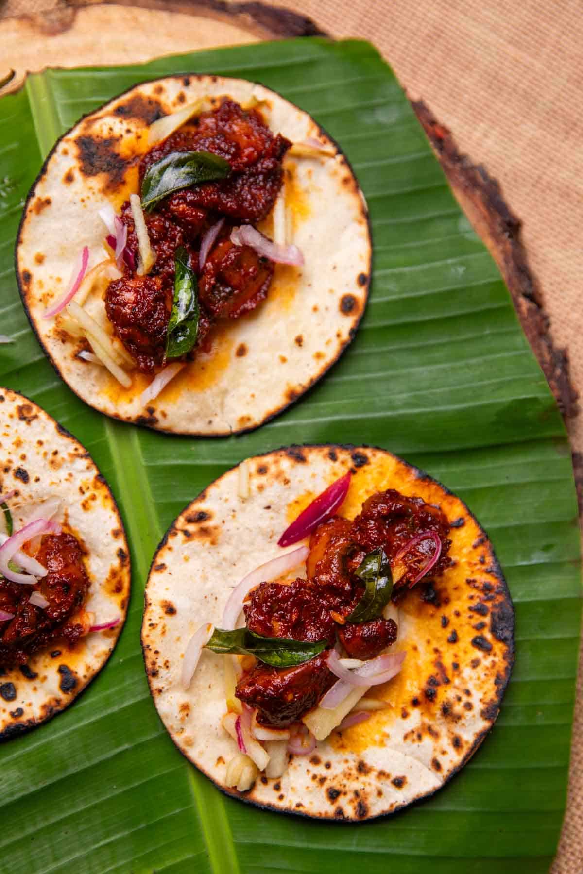 mushroom ghee roast tacos served on a leaf