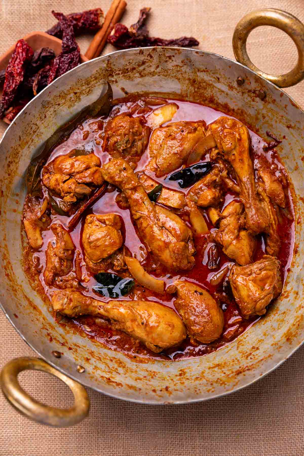 an image of freshly made nadan chicken curry in a kadai 