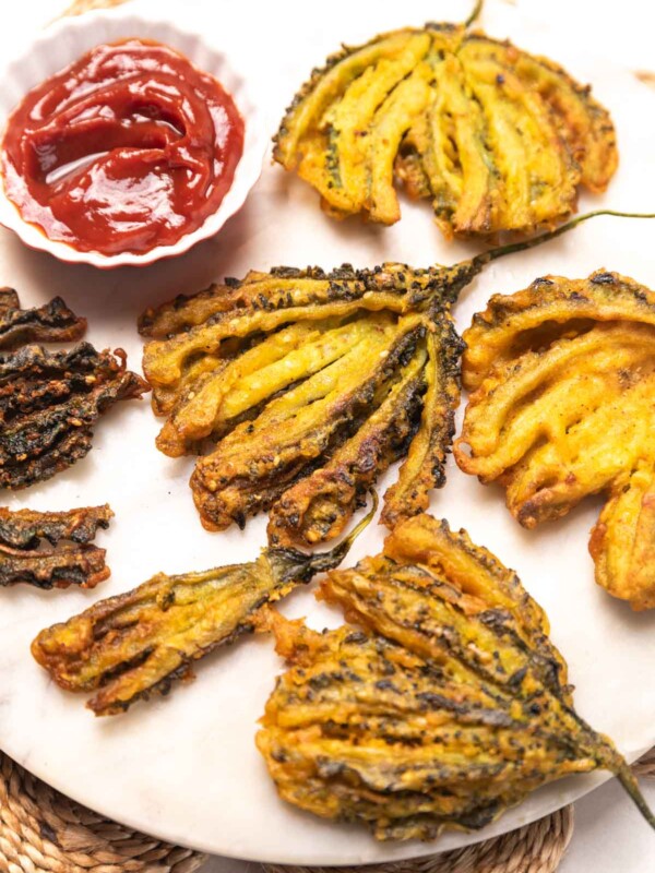 Karela pakoda served on a plate with ketchup