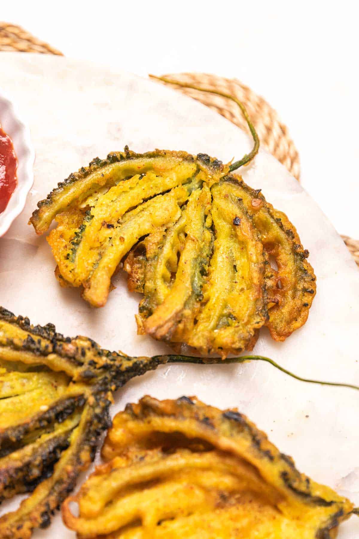 close up of karela pakoda to show it's crispy texture