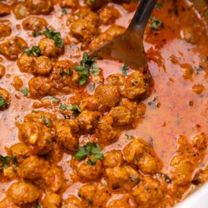 soya curry in a kadai with a ladle