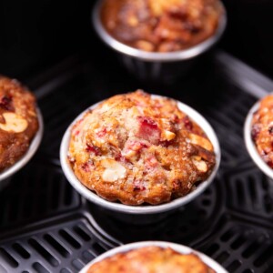 closeup image of freshly baked strawberry muffins in an air fryer