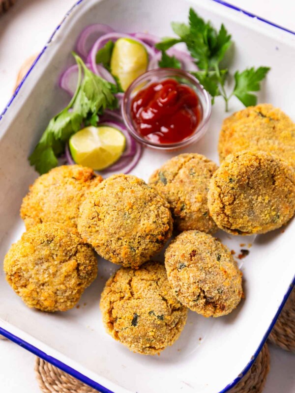 air fryer cutlet served in a white dish with accompaniments