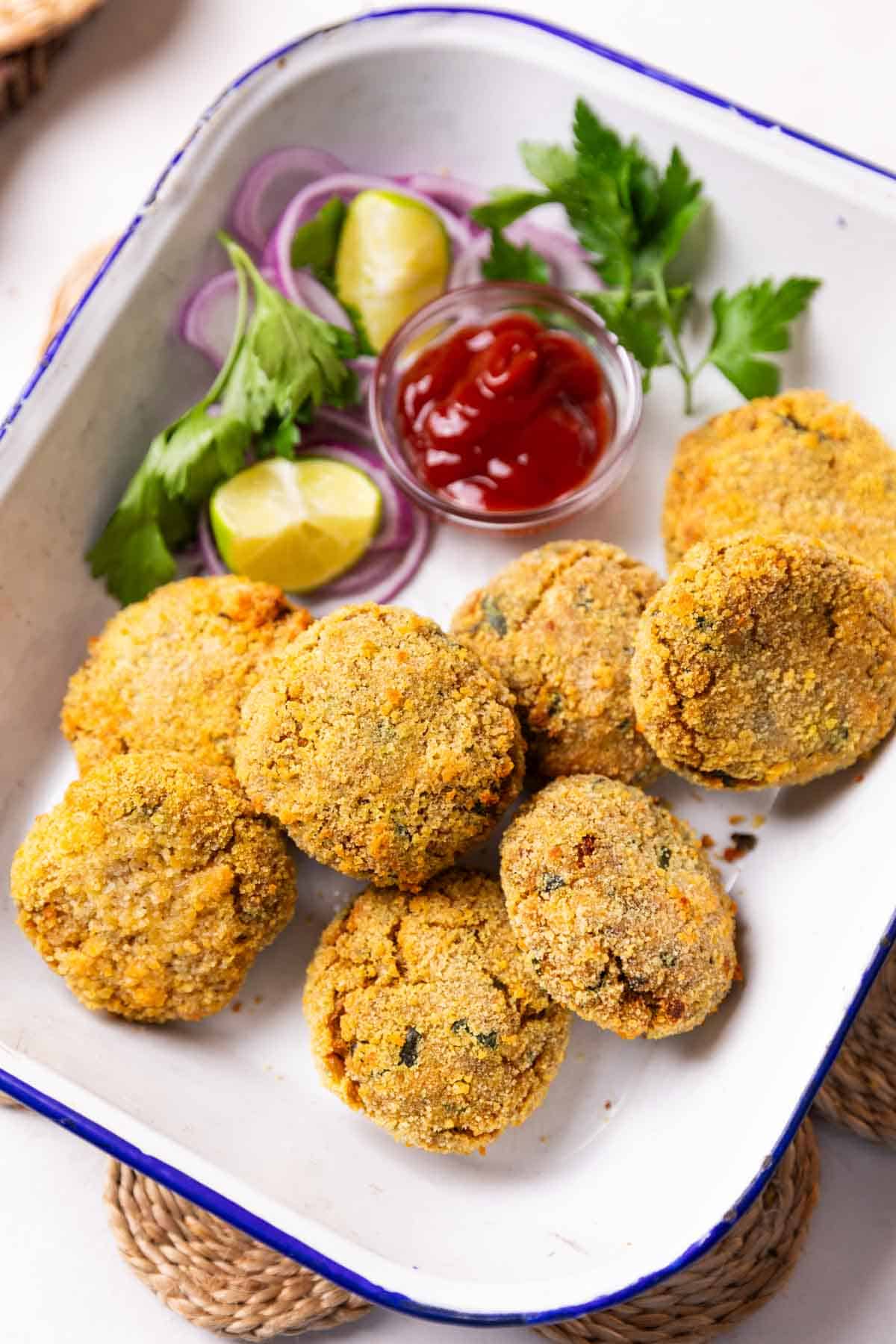 air fryer cutlet served in a white dish with accompaniments