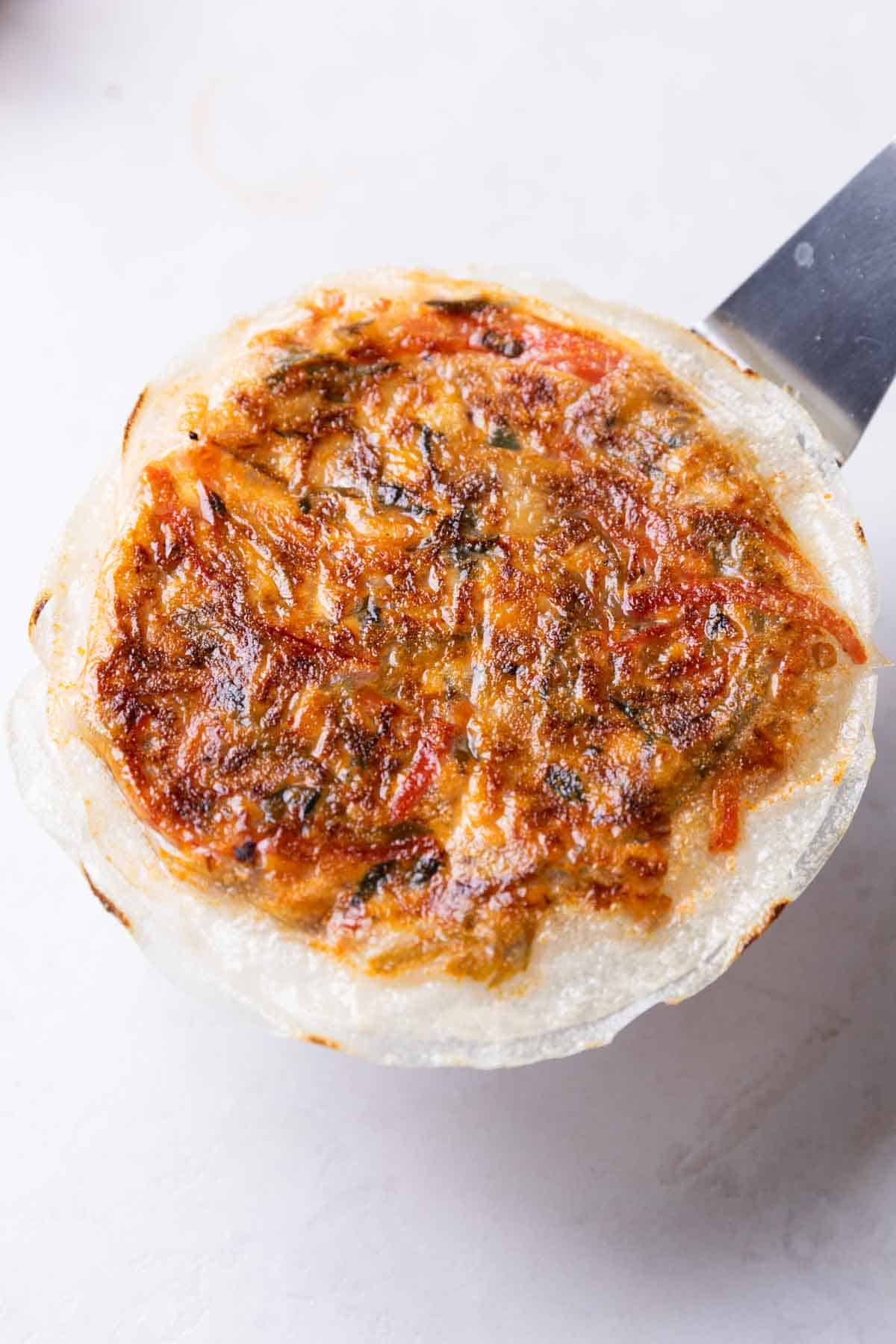 a whole rice paper pancake fresh off the stove, ready to be cut and served