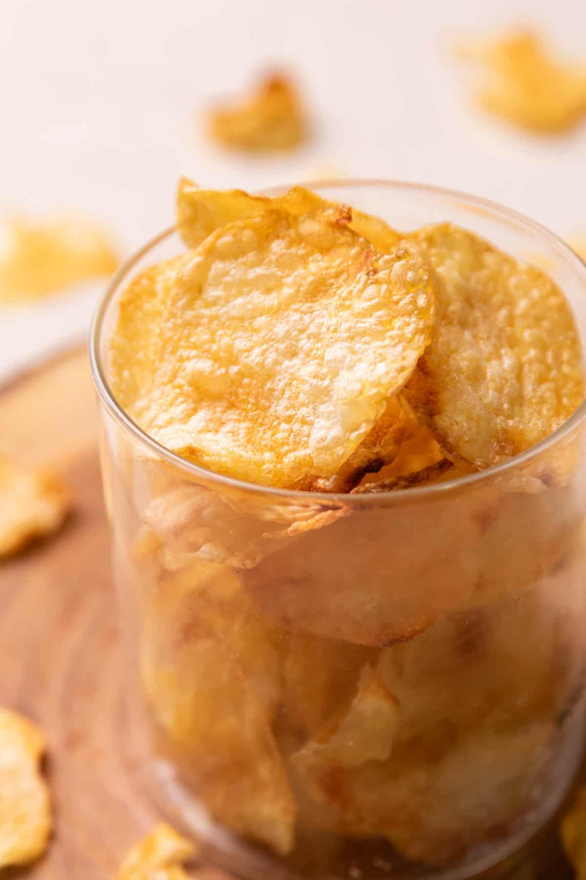 air fryer potato chips in a transparent glass container 