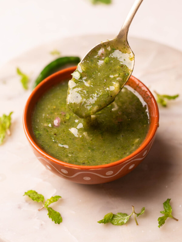 a little himachali mahni scooped up in a spoon to show it's thick texture