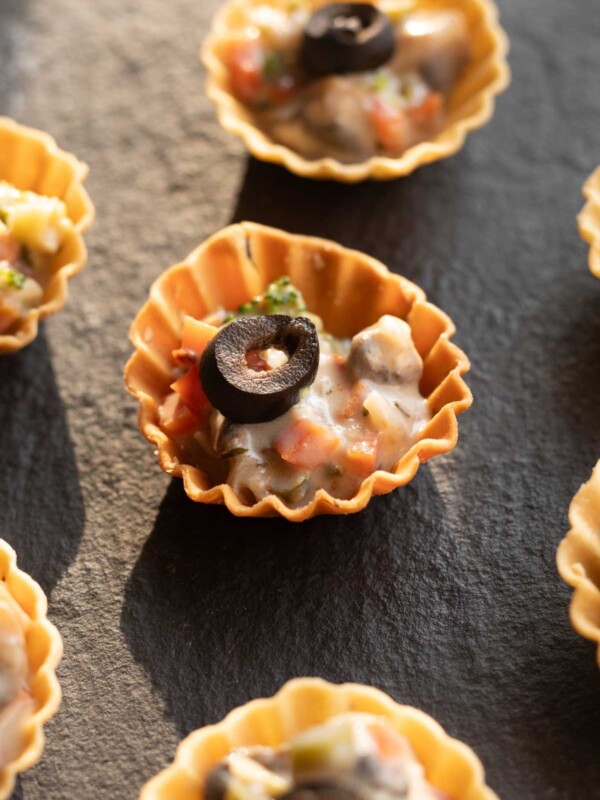 veg canapes sered on a black board ready to be eaten