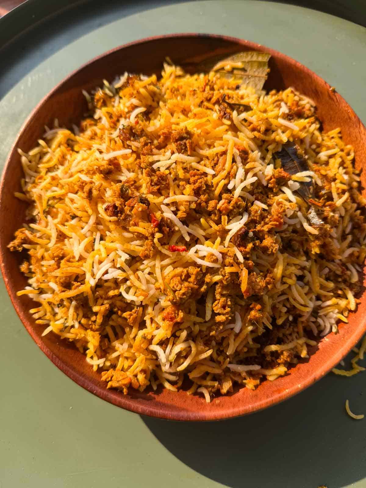 Veg soya keema biryani served in a brown bowl