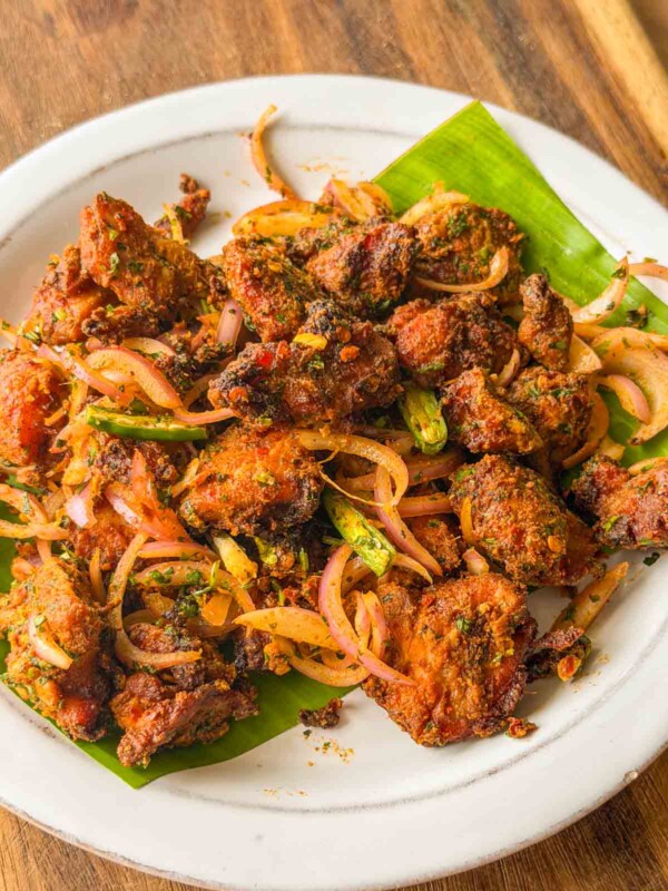an image of chicken bites served on a white plate